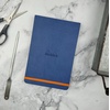 image:imageRHODIA 118742C  Black Rigid Notebook  A5  Lined  192 pages  Ivory Clairefontaine Paper 90 gm  Bookmark Elastic Closure  Faux Leather Cover  Rhodiarama CollectionSapphire