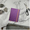image:imageRHODIA 118742C  Black Rigid Notebook  A5  Lined  192 pages  Ivory Clairefontaine Paper 90 gm  Bookmark Elastic Closure  Faux Leather Cover  Rhodiarama CollectionPurple