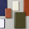 image:imageRhodia Mini Stapled Note CoverEarth Khaki 31 x 50 inches 8 x 128 cm Stapled Notebook Mini 30 x 47 inches 75 x 12 cm 02 inches 5 mm Graph with Orange Water Repellent Cover